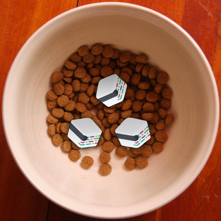 3 mabl logos in a bowl of dog food.