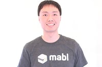 Simon has short, black hair and is wearing a mabl t shirt. He is an engineer at mabl.