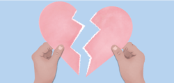 Hands holding 2 pieces of a broken heart.